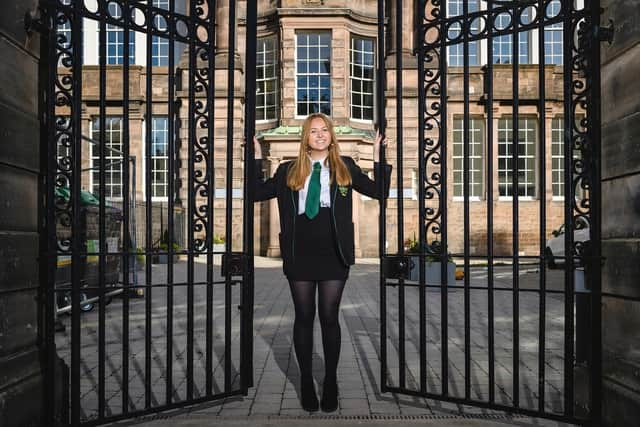 Hannah Douglas-Walker at the gates built by her great-grandfather.