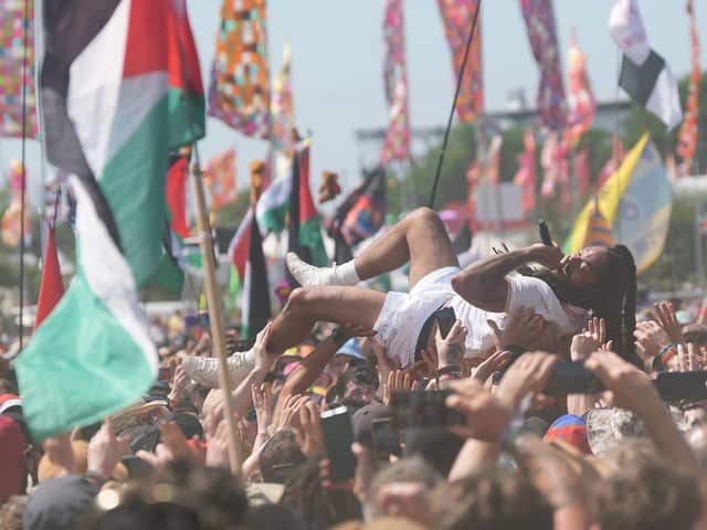Bob Vylan singer Bobby Vylan - real name Pascal Robinson-Foster - crowd surfs during his performance at the Glastonbury Festival at Worthy Farm in Somerset. The performer led crowds in chants of 'death, death to the IDF' (Picture: Yui Mok/PA Wire)