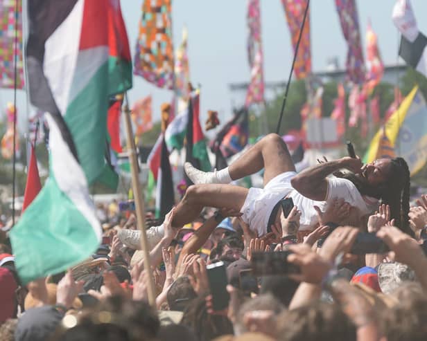 Bob Vylan singer Bobby Vylan - real name Pascal Robinson-Foster - crowd surfs during his performance at the Glastonbury Festival at Worthy Farm in Somerset. The performer led crowds in chants of 'death, death to the IDF' (Picture: Yui Mok/PA Wire)