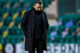 Derek McInnes cuts a dejected figure after Aberdeen lost 2-0 to Hibs.