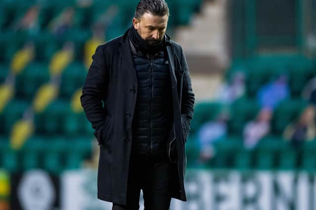 Derek McInnes cuts a dejected figure after Aberdeen lost 2-0 to Hibs.