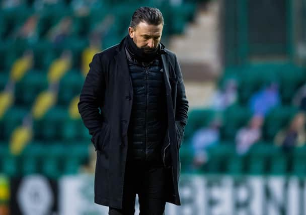 Derek McInnes cuts a dejected figure after Aberdeen lost 2-0 to Hibs.