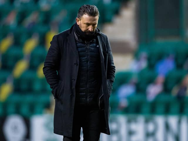 Derek McInnes cuts a dejected figure after Aberdeen lost 2-0 to Hibs.