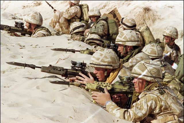British soldiers from the First Stafford, well known as the "Desert Rats", stand in a trench 06 January 1991 somewhere in Saudi desert