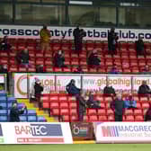 Fans look on from socially distanced positions in the stands during the Ladbrokes Scottish Premiership match between Ross County and Celtic at Global Energy Stadium on September. (Pic: Getty Images)