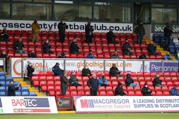 Fans look on from socially distanced positions in the stands during the Ladbrokes Scottish Premiership match between Ross County and Celtic at Global Energy Stadium on September. (Pic: Getty Images)