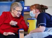 Resident Annie Innes, 90, talks with a healthcare worker at the Abercorn House Care Home in Hamilton.