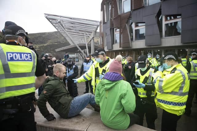 Protesters and police during a Scotland Against Lockdown demonstration outside the Scottish Parliament in Edinburgh. Picture: Jane Barlow/PA Wire
