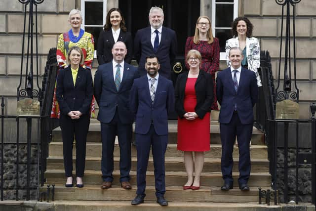 Humza Yousaf with his new Cabinet, including the Cabinet Secretary for Well-being Enconomy, Fair Work and Energy, Neil Gray to his right (Picture: Jeff J Mitchell/Getty Images)