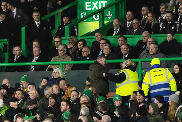 Celtic fans exchange words with members in the directors box including CEO Michael Nicholson during the defeat by Hearts.