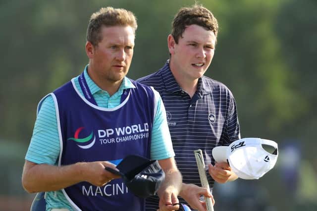 Bob MacIntyre with caddie Mike Thomson after finishing his opening round in the DP World Tour Championship at Jumeirah Golf Estates in Dubai. Picture: Andrew Redington/Getty Images.