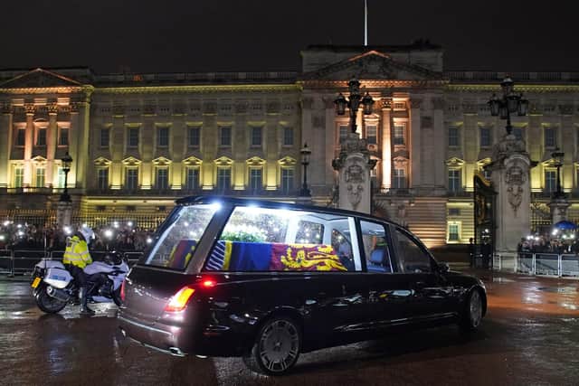 The hearse carrying the coffin of Queen Elizabeth II arrives at Buckingham Palace, London