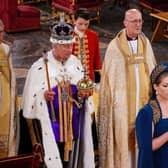 Lord President of the Council, Penny Mordaunt, holding the Sword of State walking ahead of King Charles III during the coronation. Picture: Yui Mok - WPA Pool/Getty Images