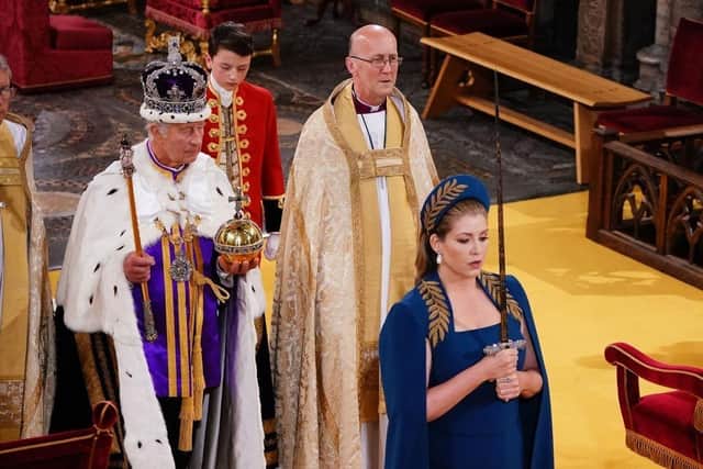Lord President of the Council, Penny Mordaunt, holding the Sword of State walking ahead of King Charles III during the coronation. Picture: Yui Mok - WPA Pool/Getty Images