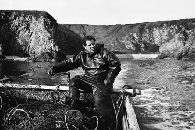 James Mackay setting off in his coble boat from the salmon netting station at Armadale, Sutherland, to fish his bag nets in 2003. Photographer Colin McPherson will return to Armadale to track the impact of the salmon netting ban on the community. PIC: Colin McPherson.