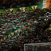 Celtic fans hold up Palestine flags during their club's 2-2 draw with Atletico Madrid in the  Champions League. (Photo by Craig Foy / SNS Group)