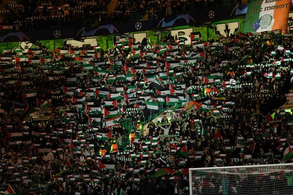 Celtic fans hold up Palestine flags during their club's 2-2 draw with Atletico Madrid in the  Champions League. (Photo by Craig Foy / SNS Group)