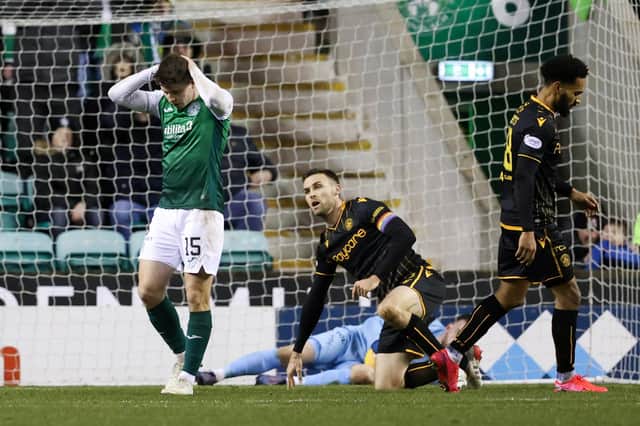 Kevin Nisbet holds his head in his hands after the Hibs striker missed a good chance late on in the 1-1 draw with Motherwell.