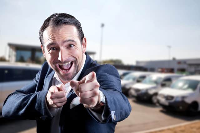 The salesperson is happy, but if your new vehicle soon disappoints, give them a chance to rectify the problem (Picture: Adobe)