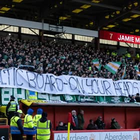 Celtic fans hold up a banner displaying a message to the Celtic board ahead of the 1-1 draw with Aberdeen at Pittodrie. (Photo by Craig Foy / SNS Group)