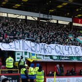 Celtic fans hold up a banner displaying a message to the Celtic board ahead of the 1-1 draw with Aberdeen at Pittodrie. (Photo by Craig Foy / SNS Group)