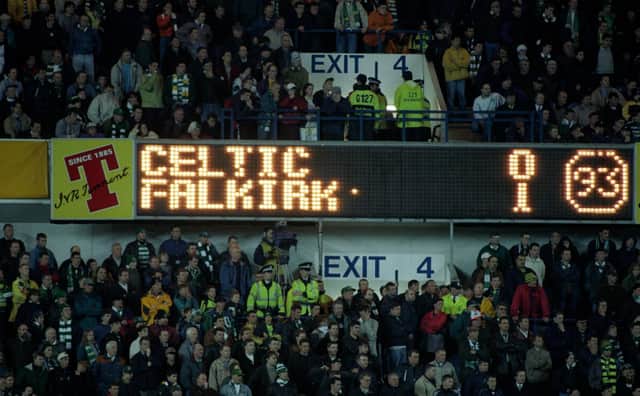 The Ibrox scoreboard details the 1997 Scottish Cup semi-final replay result that marked the end of Tommy Burns three years in charge of Celtic. (Photo by SNS).