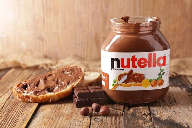 jar of nutella on wood background