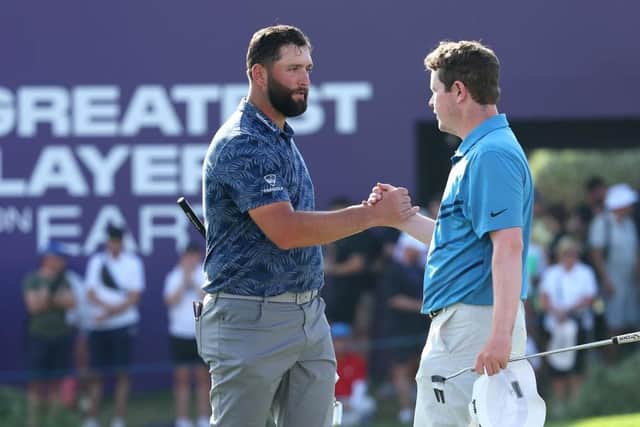 Jon Rahm and Bob MacIntyre of Scotland shake hands after playing in the DP World Tour Championship last November. Picture: Andrew Redington/Getty Images.