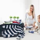 Avoid packing mistakes by using dividers and remembering a separate laundry bag and first aid kit, especially if travelling with family. Pic: Alamy/PA.
