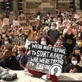 Protesters gather in support of the Black Lives Matter and Black Voices Matter movements in central Leeds on June 14, 2020 in the aftermath of the death of unarmed black man George Floyd in police custody in the US. (Photo by OLI SCARFF/AFP via Getty Images)