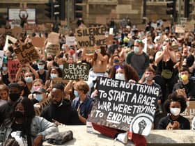 Protesters gather in support of the Black Lives Matter and Black Voices Matter movements in central Leeds on June 14, 2020 in the aftermath of the death of unarmed black man George Floyd in police custody in the US. (Photo by OLI SCARFF/AFP via Getty Images)