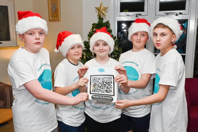 The Denny Five brought festive cheer to the hospice and are also helping promote the charity's festive fundraising campaign. Pic: Michael Gillen