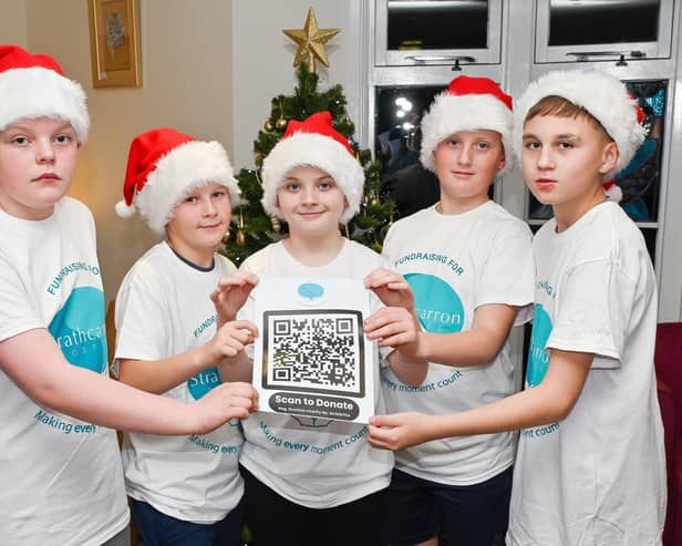 The Denny Five brought festive cheer to the hospice and are also helping promote the charity's festive fundraising campaign. Pic: Michael Gillen
