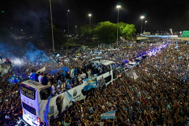 The newly crowned champions of the world boarded an open-top bus and several, including Messi, could be seen singing the words of Muchachos while they waited for everyone to get on, before heading to the headquarters of the Argentine Football Association.