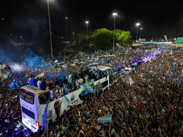 The newly crowned champions of the world boarded an open-top bus and several, including Messi, could be seen singing the words of Muchachos while they waited for everyone to get on, before heading to the headquarters of the Argentine Football Association.