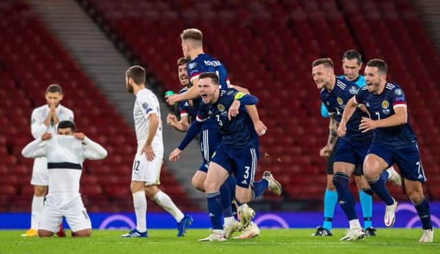 GLASGOW, SCOTLAND - OCTOBER 08: Scotland's players celebrate winning the shoot out during a Euro 2020 Play off match between Scotland and Israel at Hampden Park, on October 08 2020, in Glasgow, Scotland (Photo by Alan Harvey / SNS Group)