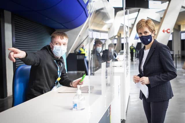 First Minister of Scotland Nicola Sturgeon arrives to get her first shot
