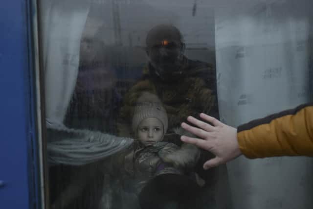A father puts his hand on the window as he says goodbye to his daughter in front of an evacuation train at the central train station in Odesa in March 2022. The two-year anniversary of the Russian invasion of Ukraine falls on Saturday. Piture: Bulent Kilic/AFP via Getty Images