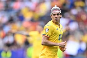 Romania and Rangers midfielder Ianis Hagi looks on during the Euro 2024 round of 16 defeat to Netherlands. (Photo by KIRILL KUDRYAVTSEV/AFP via Getty Images)