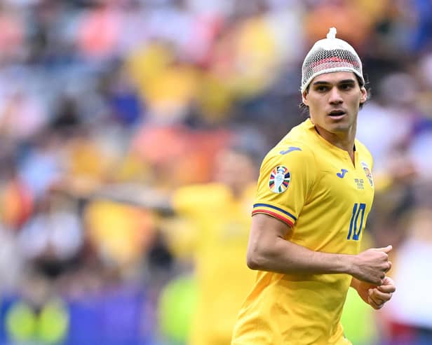 Romania and Rangers midfielder Ianis Hagi looks on during the Euro 2024 round of 16 defeat to Netherlands. (Photo by KIRILL KUDRYAVTSEV/AFP via Getty Images)