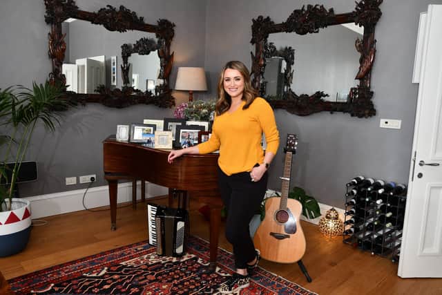 Scottish broadcaster for BBC Alba and BBC Scotland and voice of Scotland's Home of the Year, Anne McAlpine, with the second-hand baby grand piano she and her husband bought during lockdown.