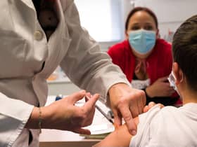 A child receives a dose of Pfizer/BioNTech Covid 19 vaccine. Picture: Sebastien Bozon/AFP via Getty Images