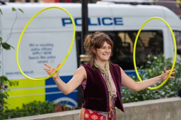 A protestor juggles hula hoops at an Extinction Rebellion protest in Parliament Square, London, on Friday, as part of 10 days of protests. Pic: PA