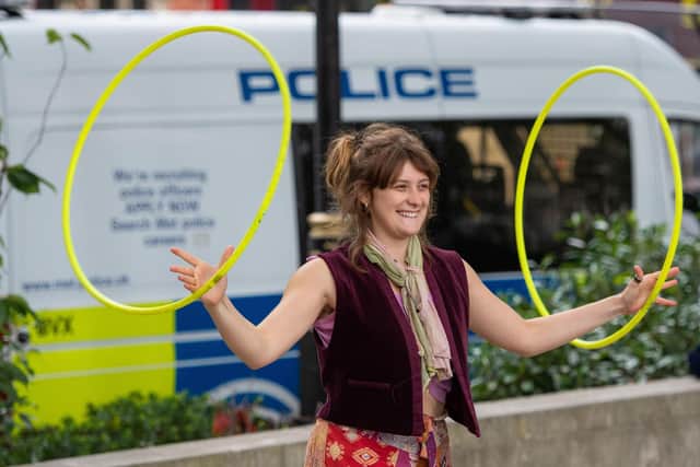 A protestor juggles hula hoops at an Extinction Rebellion protest in Parliament Square, London, on Friday, as part of 10 days of protests. Pic: PA
