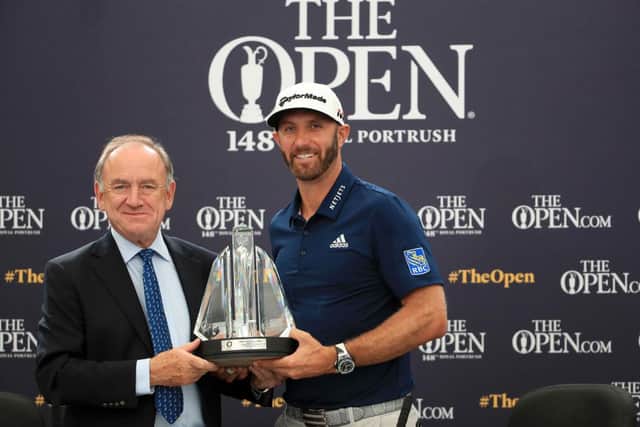 Peter Dawson charman of the Official World Golf Ranking, presents Dustin Johnson with the OWGR McCormack Award during the 2019 Open at Royal Portrush. Picture: Andrew Redington/Getty Images.