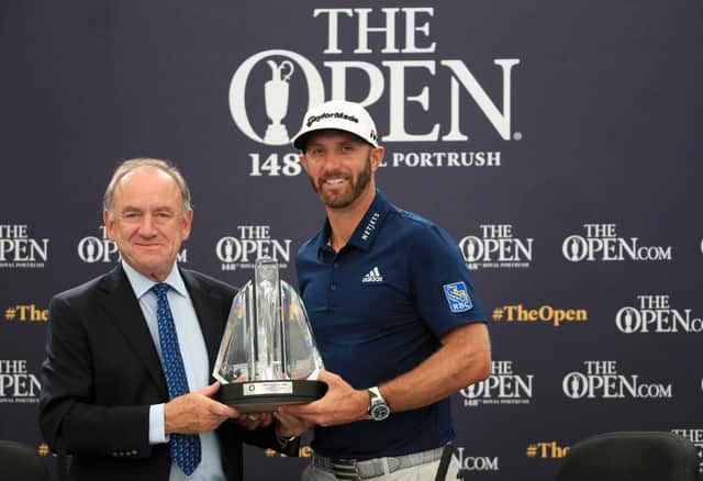 Peter Dawson charman of the Official World Golf Ranking, presents Dustin Johnson with the OWGR McCormack Award during the 2019 Open at Royal Portrush. Picture: Andrew Redington/Getty Images.