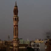 Smoke billows behind buildings in southern Khartoum. Picture: AFP via Getty Images