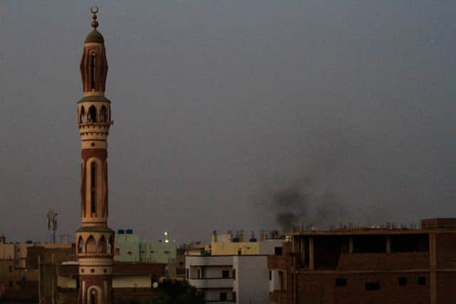 Smoke billows behind buildings in southern Khartoum. Picture: AFP via Getty Images