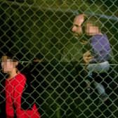 A view of people thought to be migrants at the Manston immigration short-term holding facility located at the former Defence Fire Training and Development Centre in Thanet, Kent. Picture: Gareth Fuller/PA Wire