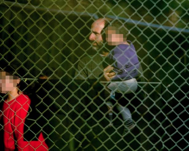 A view of people thought to be migrants at the Manston immigration short-term holding facility located at the former Defence Fire Training and Development Centre in Thanet, Kent. Picture: Gareth Fuller/PA Wire